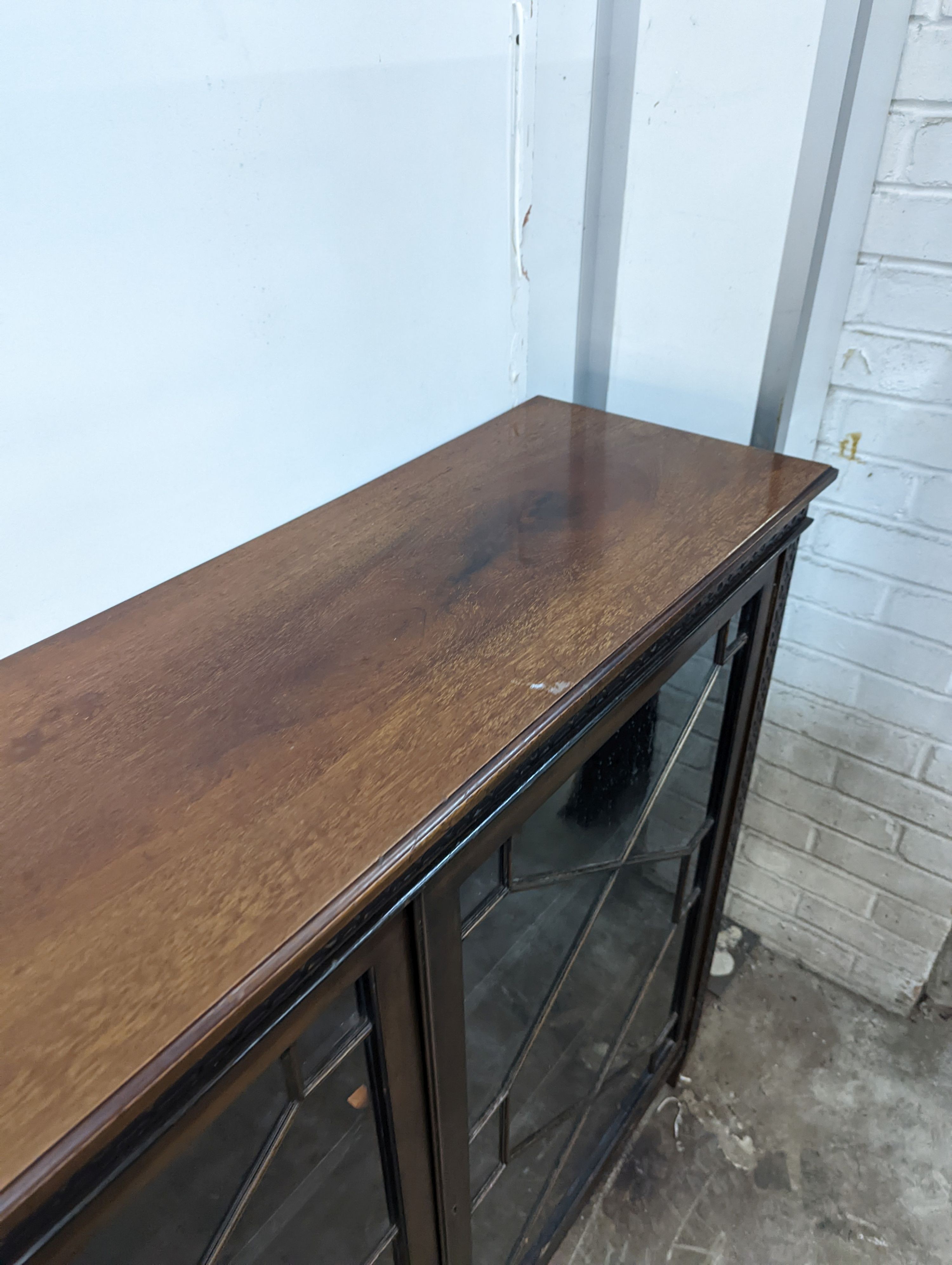 An Edwardian Chippendale revival astragal glazed mahogany bookcase, length 122cm, depth 35cm, height 107cm